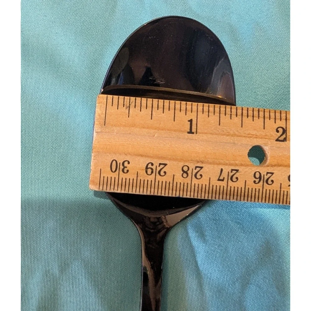 8 larger Black Spoons 7